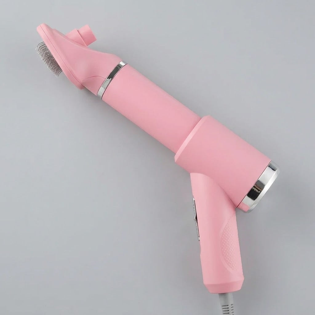PawDry grooming dryer brush in pink with the slicker brush head attached, shown on a plain grey background