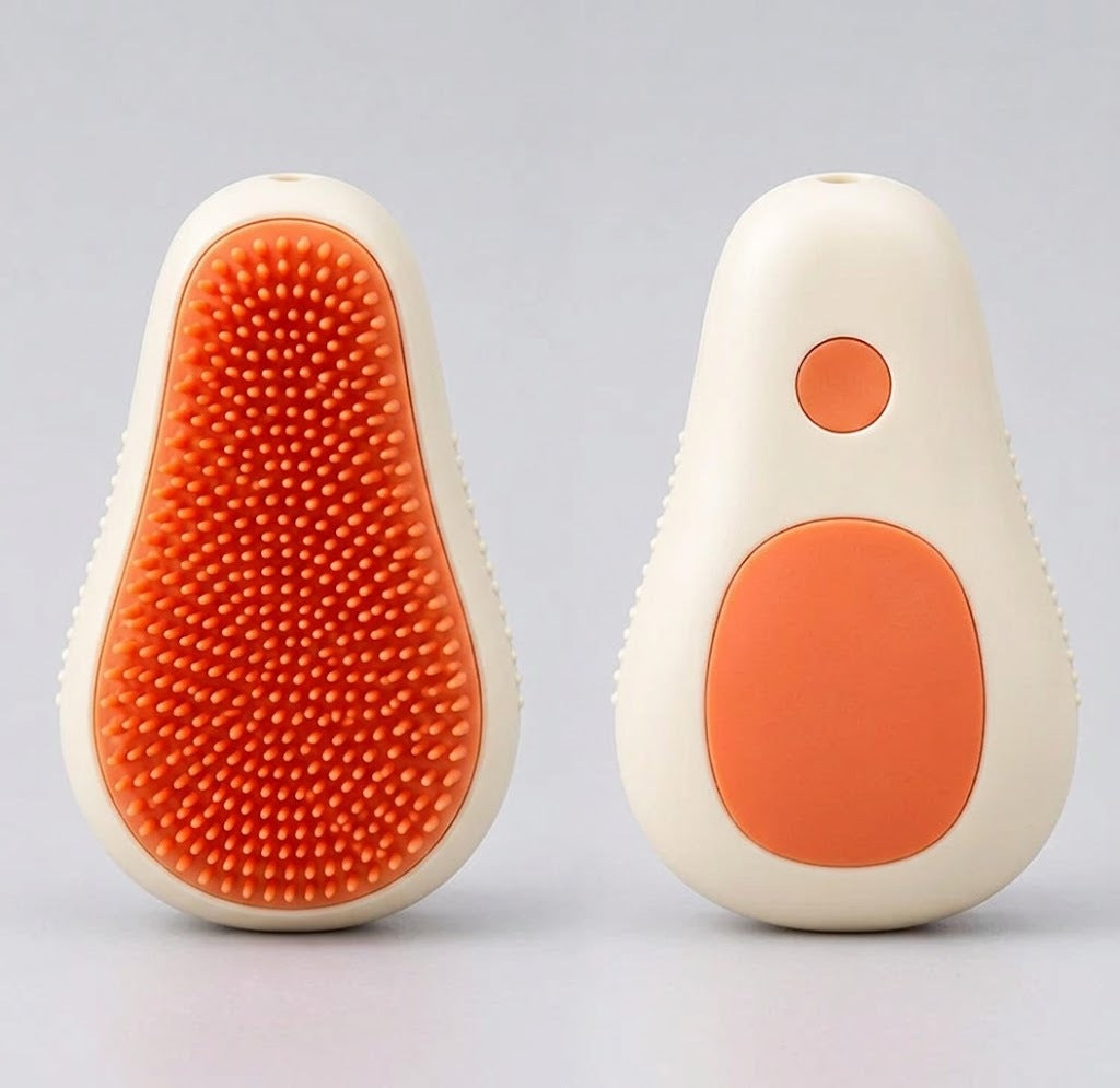 3-in-1 pet spa brush in cream white, front and back, showing the orange silicone bristles and the shampoo button