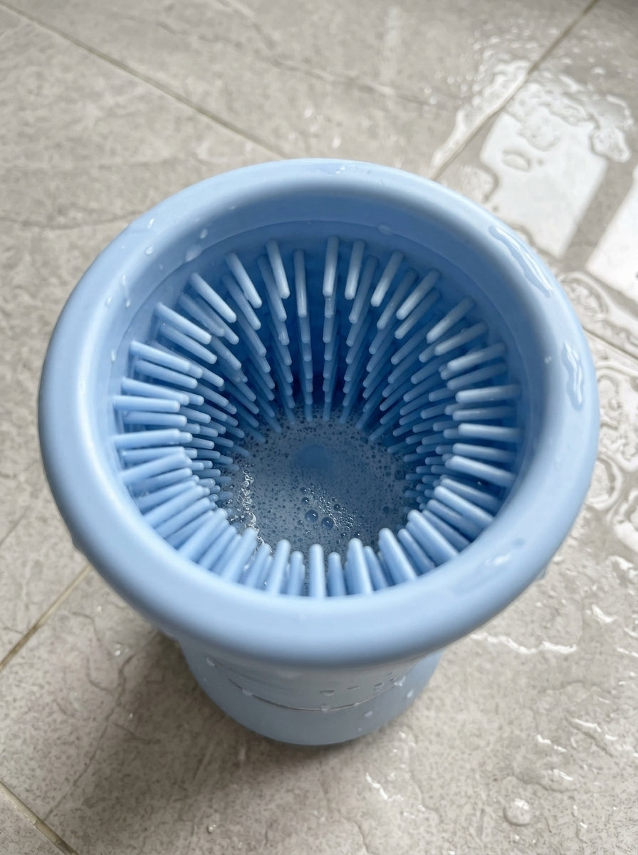 Close-up looking into the PawWash cup at the soft silicone bristles that scrub the paw