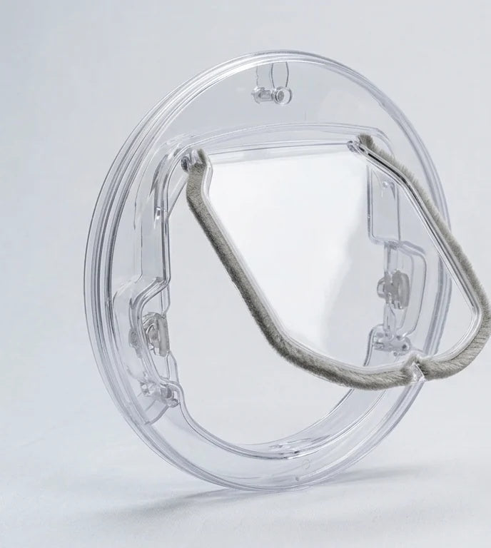 Freedom Feline round cat flap in the clear transparent finish, shown on a plain light background